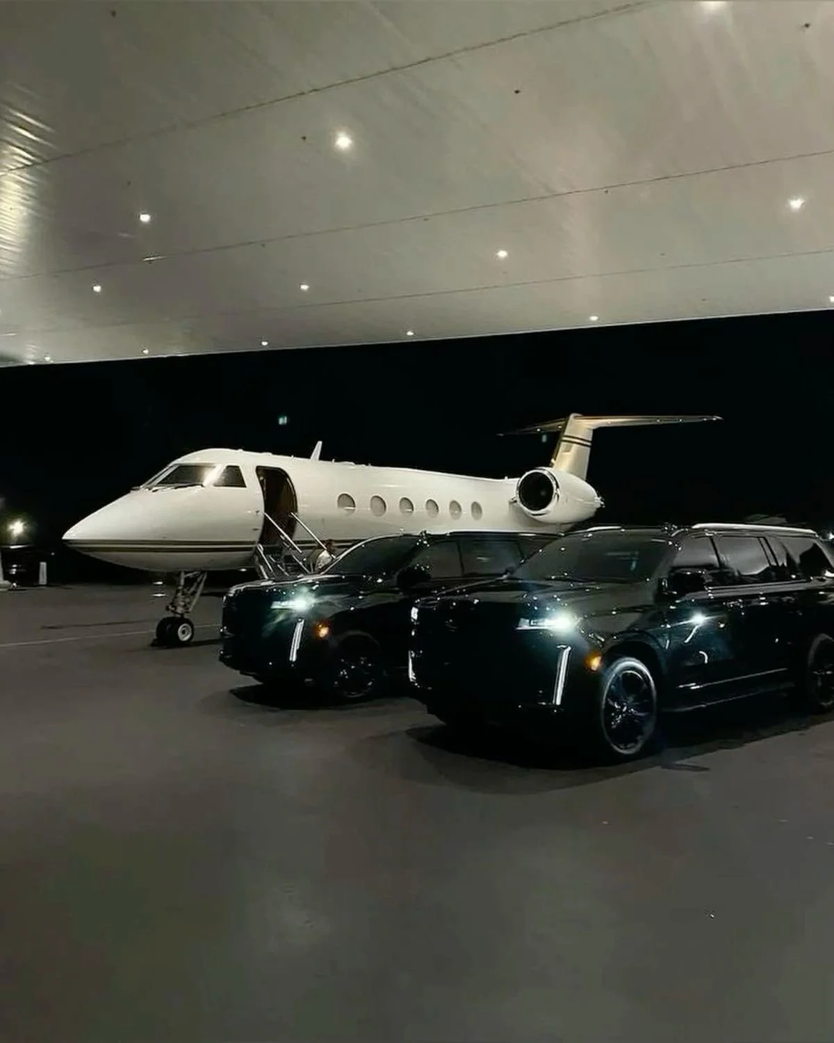 Private jet with luxury cars